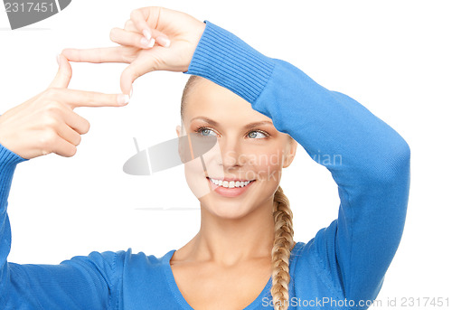 Image of lovely woman creating a frame with fingers