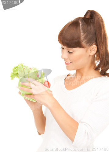 Image of beautiful housewife with vegetables