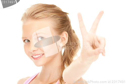 Image of lovely girl showing victory sign