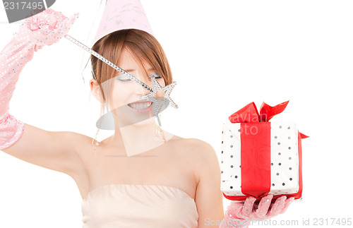 Image of teenage party girl with magic wand and gift box