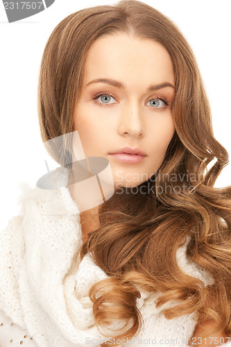 Image of beautiful woman in white comforter