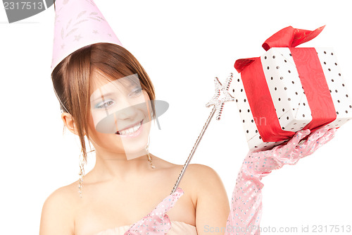 Image of teenage party girl with magic wand and gift box