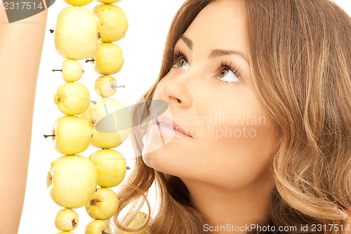 Image of lovely woman with green apples