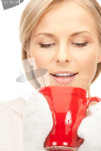 Image of beautiful woman with red mug