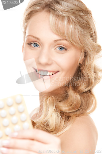 Image of young woman with pills