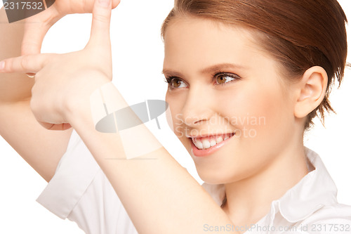 Image of lovely woman creating a frame with fingers