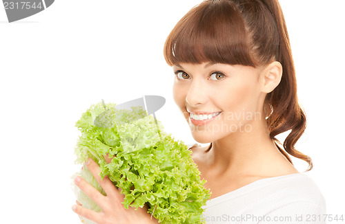 Image of beautiful housewife with lettuce over white