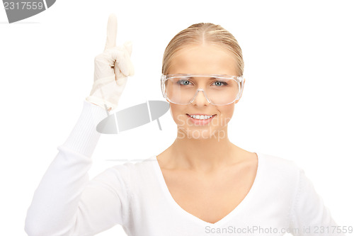 Image of woman in protective glasses and gloves
