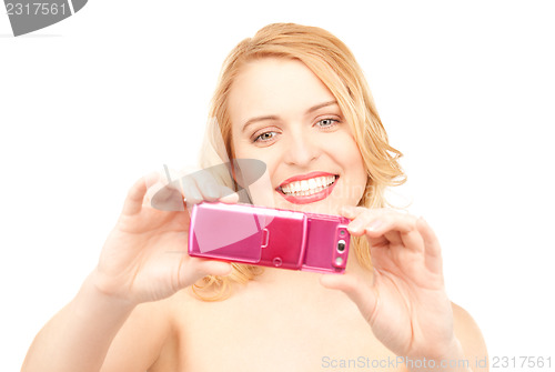 Image of happy woman using phone camera