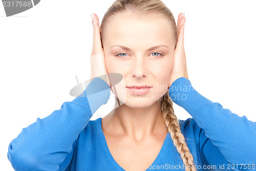 Image of woman with hands on ears