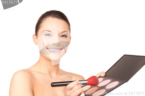 Image of lovely woman with palette and brush