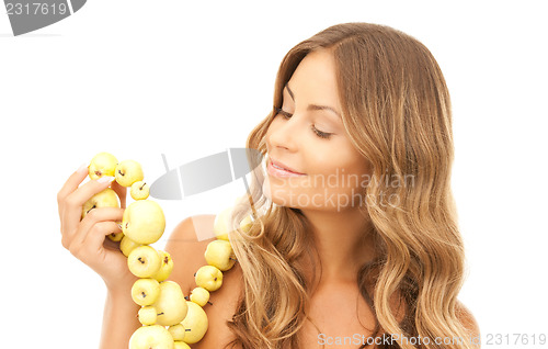 Image of lovely woman with green apples 