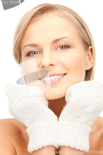 Image of beautiful woman in white mittens 
