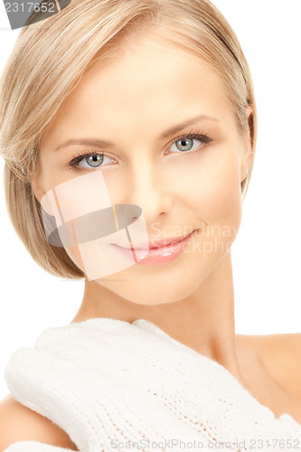 Image of beautiful woman in white mittens 
