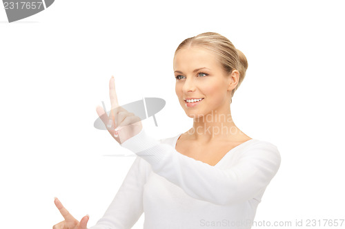 Image of businesswoman working with something imaginary