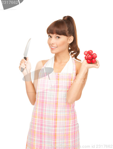 Image of housewife with big knife and radish