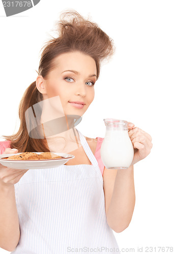 Image of housewife with milk and cookies