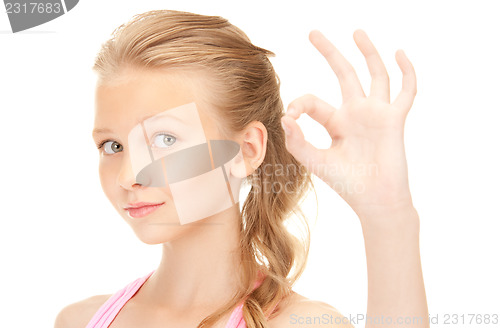 Image of lovely girl showing ok sign