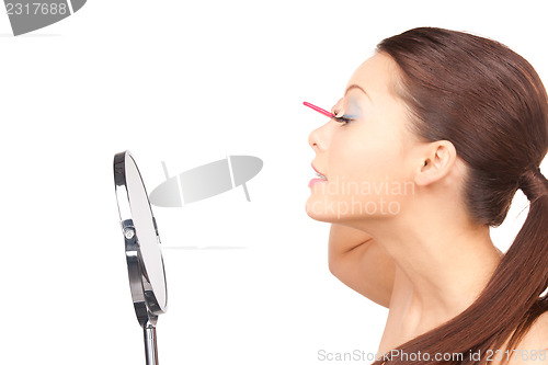 Image of beautiful woman with comb