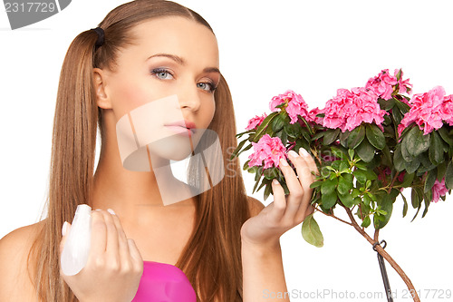 Image of lovely housewife with flowers