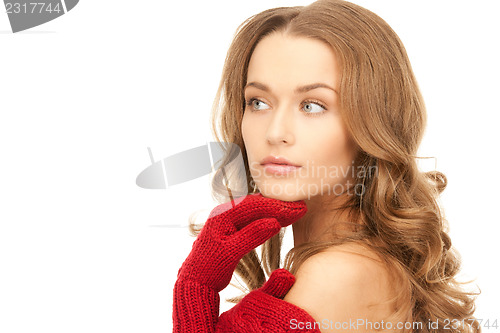 Image of beautiful woman in red mittens 