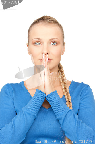 Image of praying businesswoman