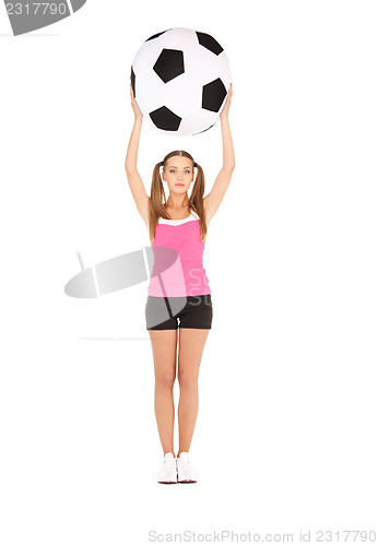 Image of lovely woman with big soccer ball