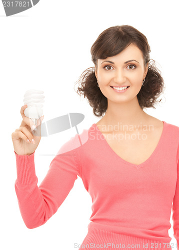 Image of woman holding energy saving bulb