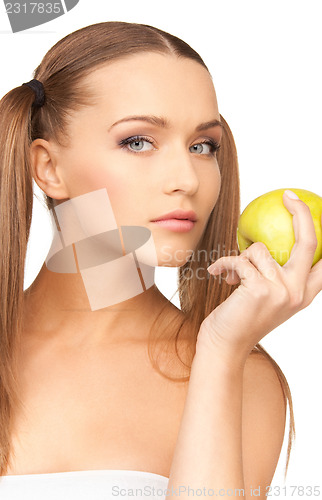 Image of young beautiful woman with green apple