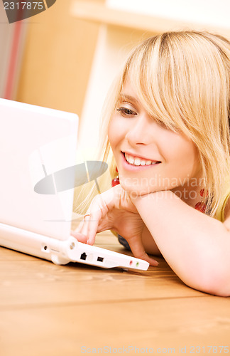 Image of teenage girl with laptop computer