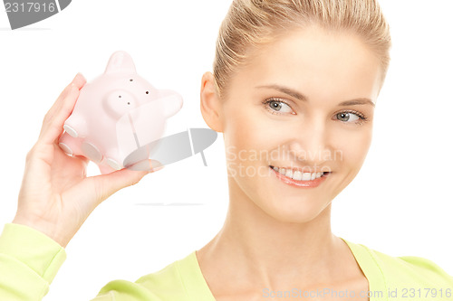 Image of woman with piggy bank