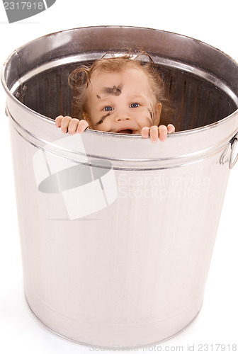 Image of baby in trash can