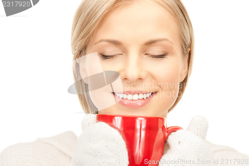 Image of beautiful woman with red mug