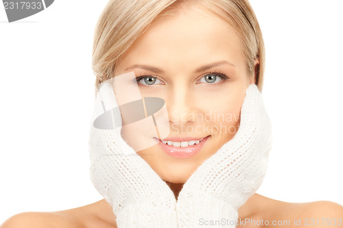 Image of beautiful woman in white mittens 