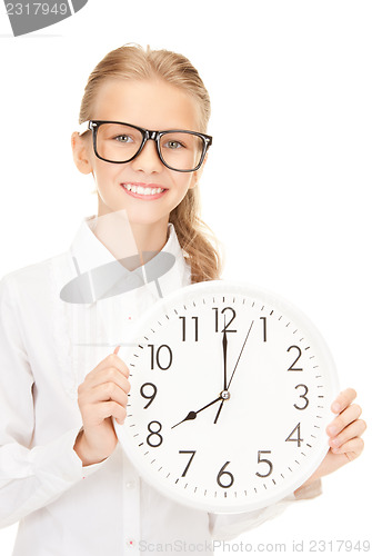 Image of girl holding big clock