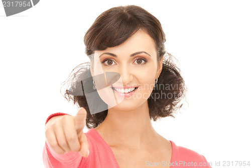 Image of attractive businesswoman pointing her finger