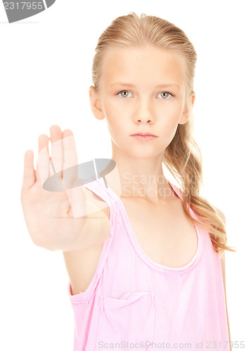 Image of lovely girl showing stop sign