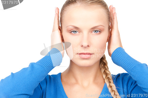 Image of woman with hands on ears