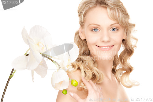 Image of beautiful woman with white flower