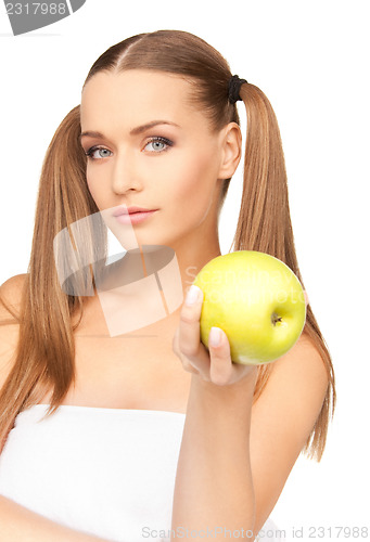Image of young beautiful woman with green apple