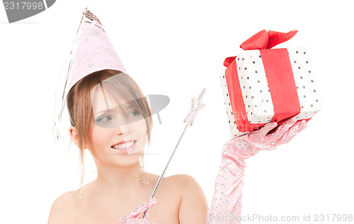 Image of teenage party girl with magic wand and gift box