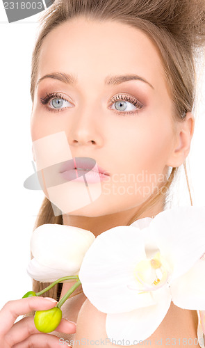 Image of beautiful woman with white flower