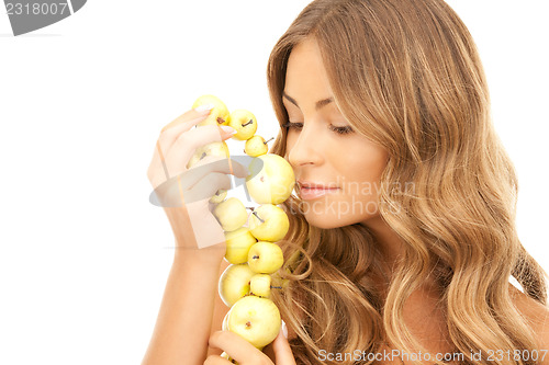 Image of lovely woman with green apples