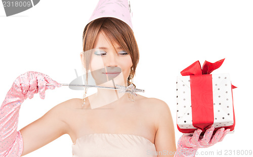 Image of teenage party girl with magic wand and gift box