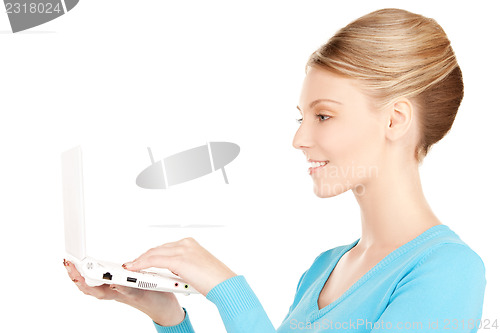 Image of happy woman with laptop computer