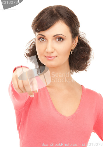 Image of attractive businesswoman pointing her finger