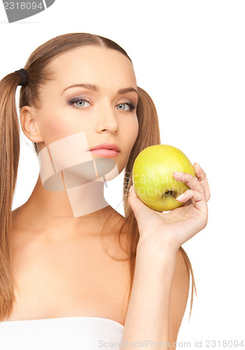 Image of young beautiful woman with green apple