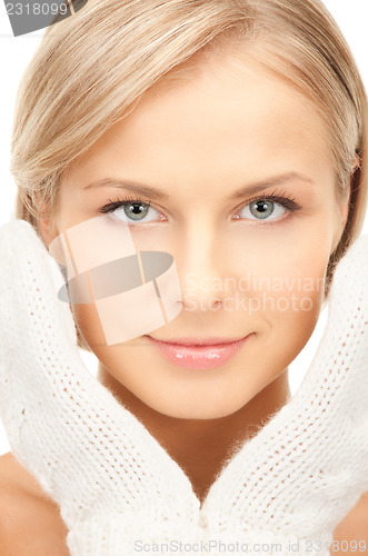 Image of beautiful woman in white mittens