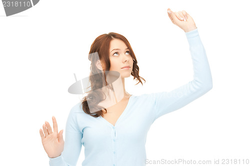 Image of businesswoman working with something imaginary