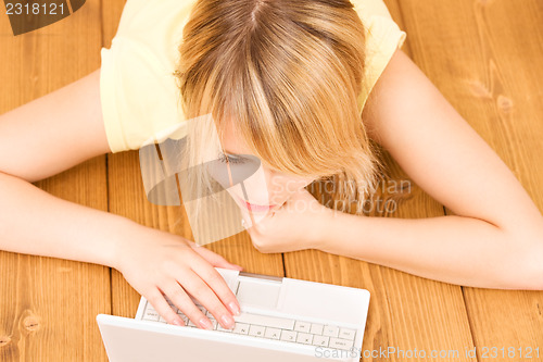 Image of teenage girl with laptop computer